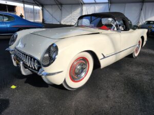 Professional car appraiser inspection of a Polo White 1953 Chevrolet Corvette roadster on the Mecum Kissimmee 2026 auction floor.