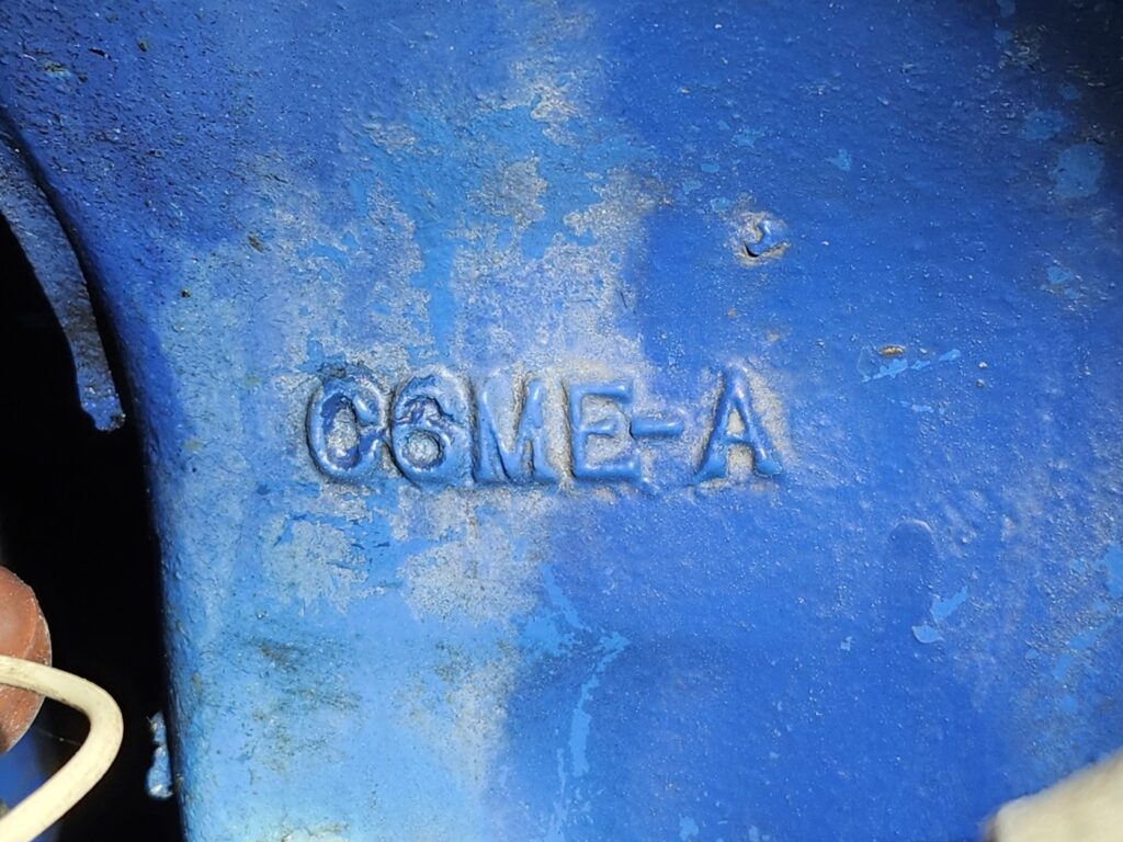 Technical photo showing a 1967 Ford 427 engine block casting number used to determine the manufacturing date and authenticity of a classic car.