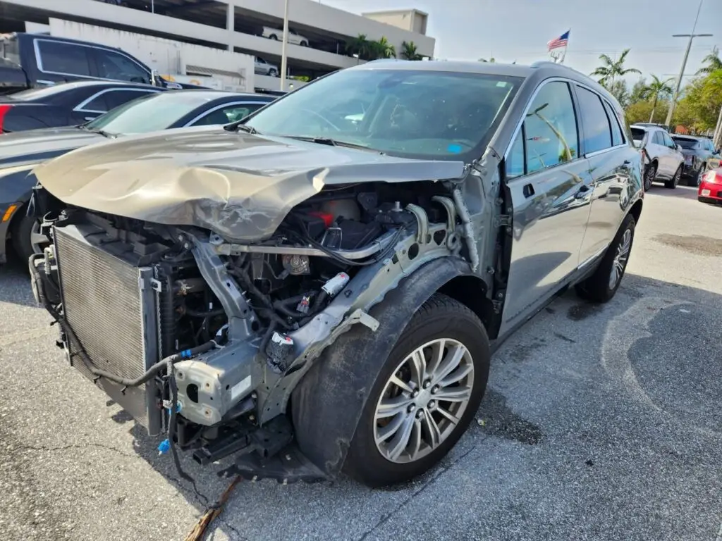 Comprehensive Cadillac XT5 inspection for a diminished value appraisal Pembroke Pines to document severe front-end collision damage for insurance recovery.