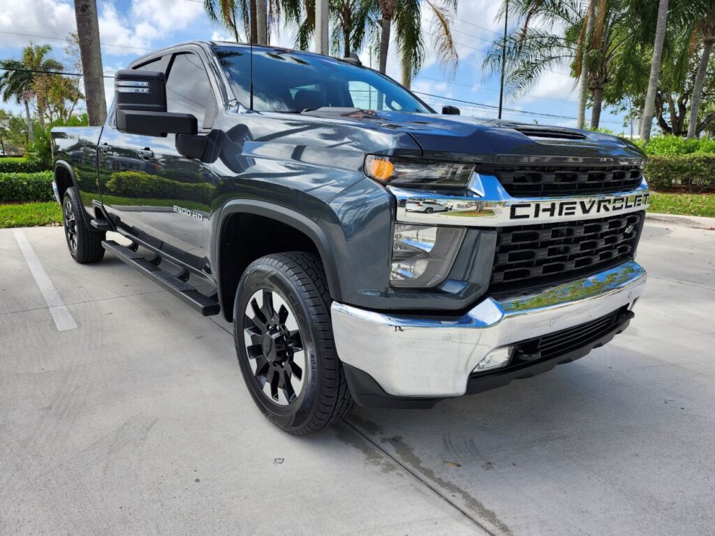 Auto Praise Documenting the market impact of front-end repairs on a dark grey 2021 Chevrolet Silverado 2500 HD for a diminished value appraisal in Homestead Florida.