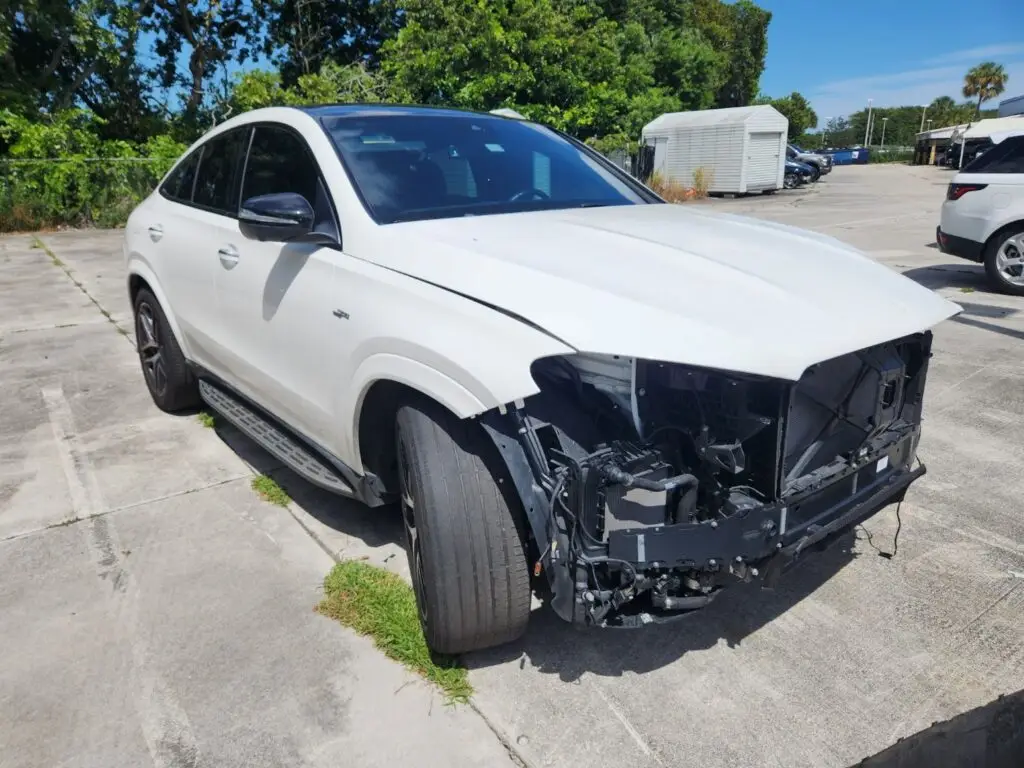 Front-end damage on a Mercedes-AMG GLE 53 in Boca Raton, demonstrating the extensive teardown required for repairs that reduce a vehicle’s worth, and how a diminished value appraisal can assist in recovering the loss in vehicle value.