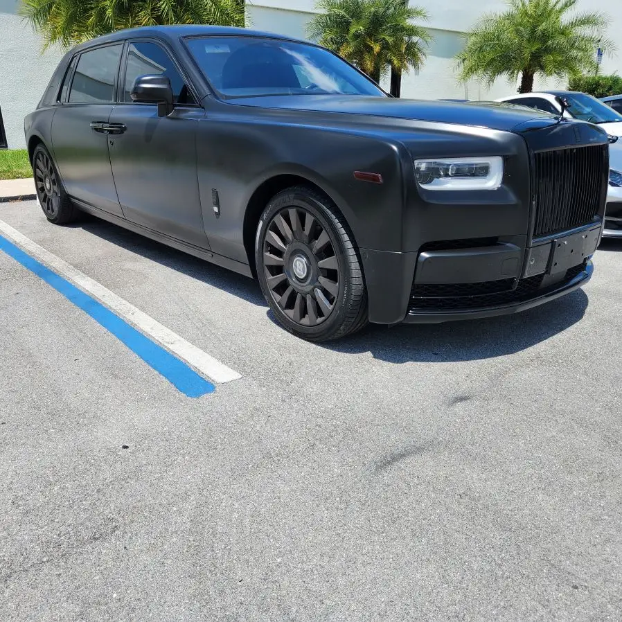 A matte black Rolls-Royce Phantom undergoing a professional diminished value appraisal in West Palm Beach to document the inherent loss in market value following a collision repair