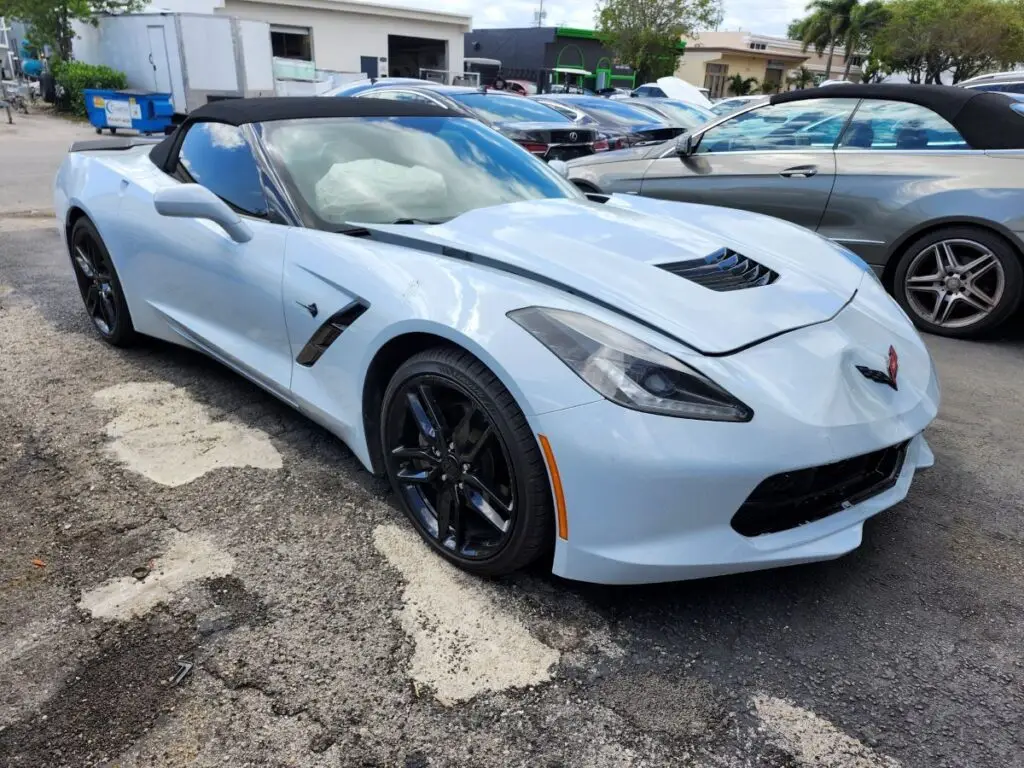 Front-view market valuation of a light blue Chevrolet Corvette C7 to support a certified diminished value appraisal in Boynton Beach Florida.