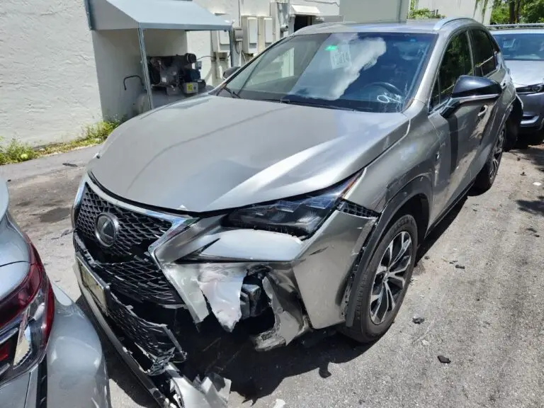 Documenting significant front-end collision damage on a grey Lexus NX 300 for a diminished value appraisal in Boynton Beach.