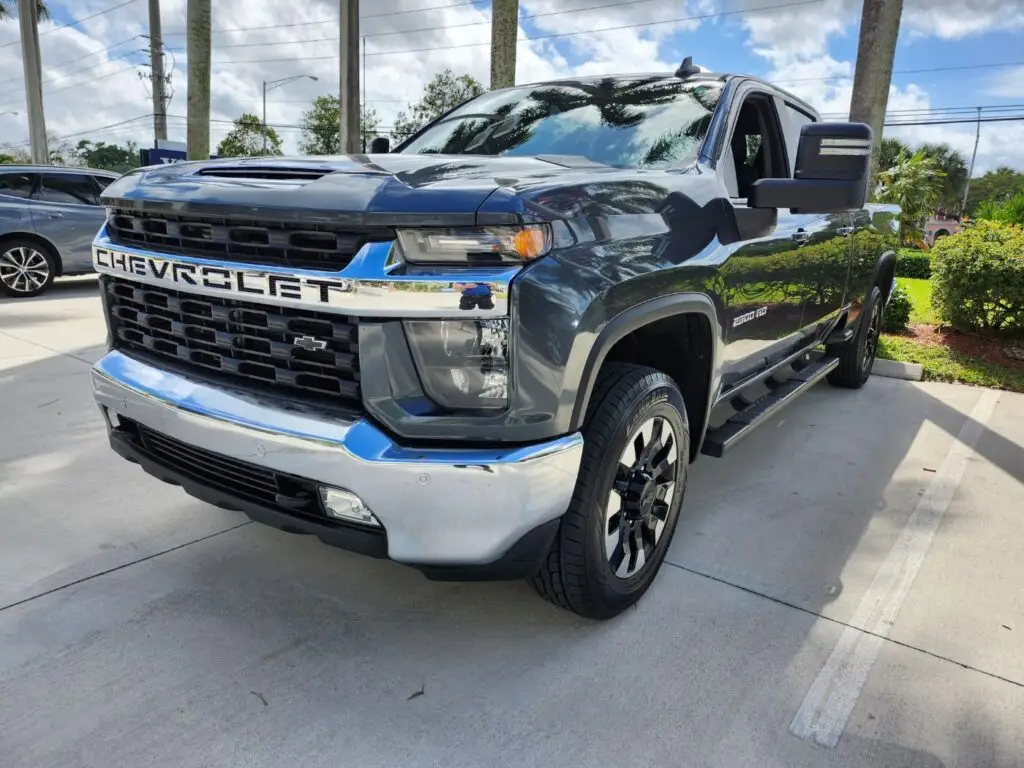 Evaluating the market loss of a grey Chevrolet Silverado 2500 HD as part of a professional diminished value appraisal in Coral Springs.