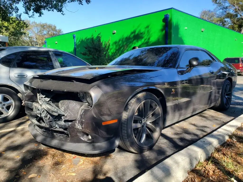 Assessing the market impact of major front-end repairs on a charcoal 2016 Dodge Challenger for a diminished value appraisal Daytona.