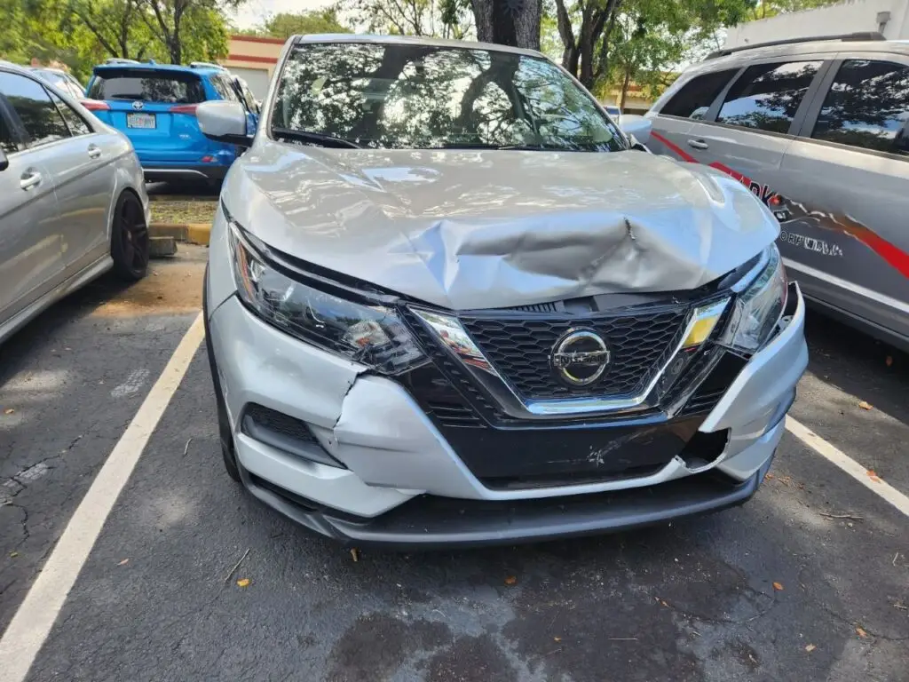 Documenting significant front-end collision damage on a silver 2021 Nissan Rogue for a diminished value appraisal Daytona Florida.