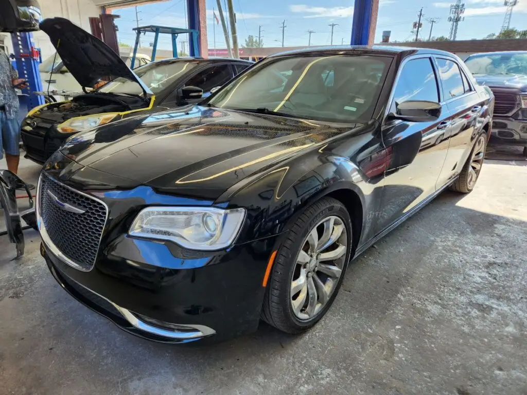 Front-angle market assessment of a black 2019 Chrysler 300 to support a certified diminished value appraisal in Deerfield Beach.