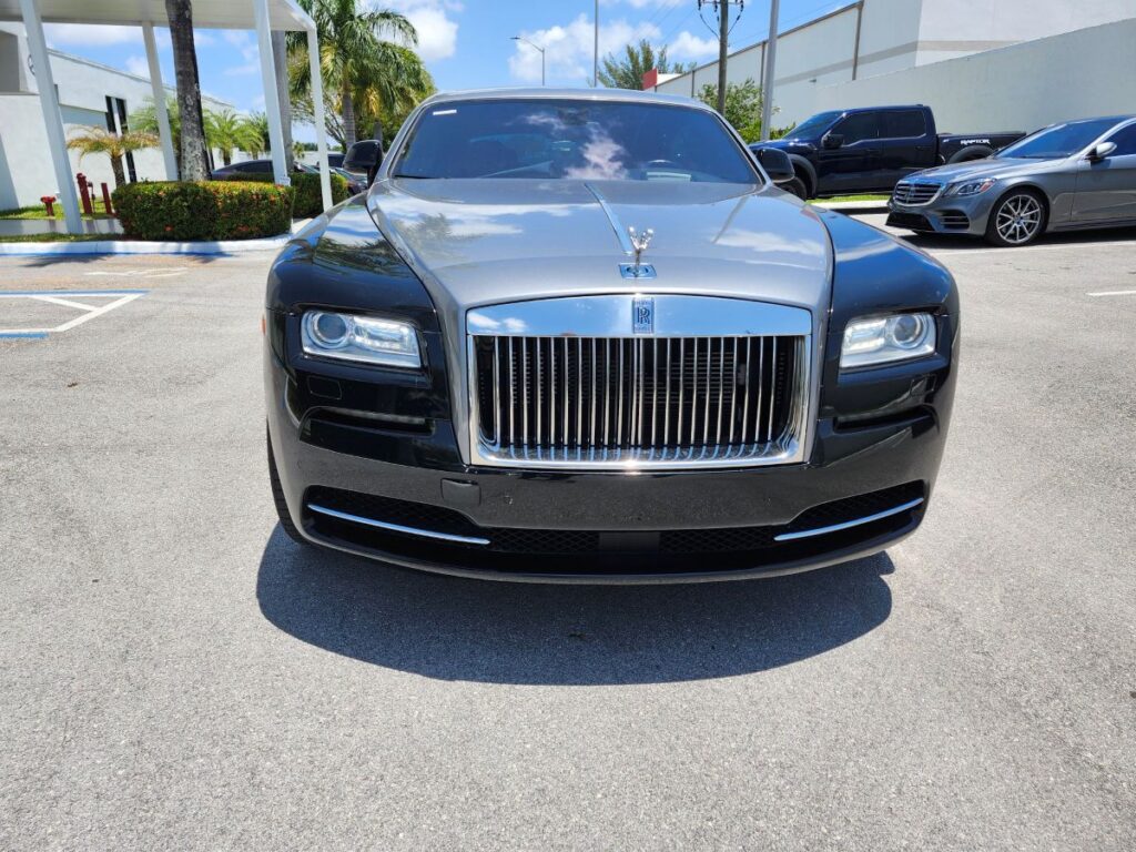 Front-view market assessment of a black and silver Rolls-Royce Ghost for a specialized diminished value appraisal in Delray Beach.