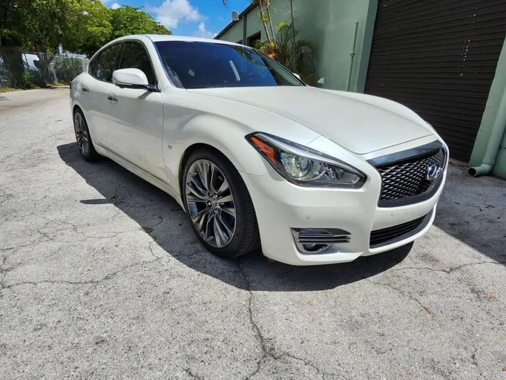 Front-angle valuation of a white 2017 Infiniti Q70 to support a certified diminished value appraisal Fort Myers Florida.