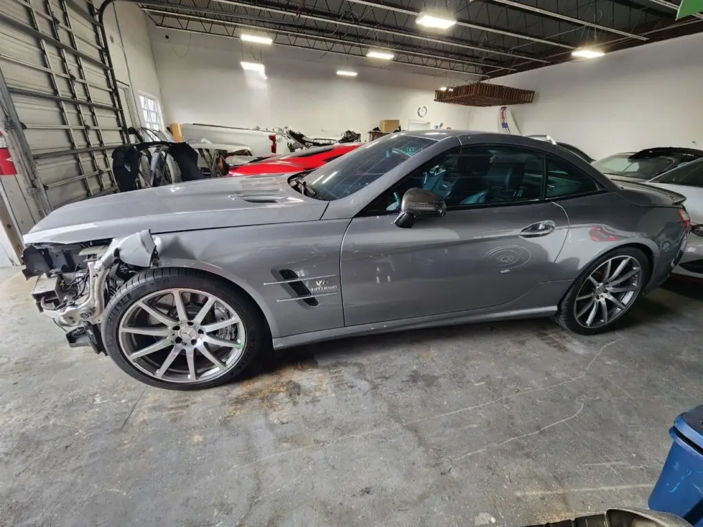 Assessing front-end collision and structural repairs on a grey 2014 Mercedes-Benz SL63 AMG for a diminished value appraisal Jacksonville Florida.
