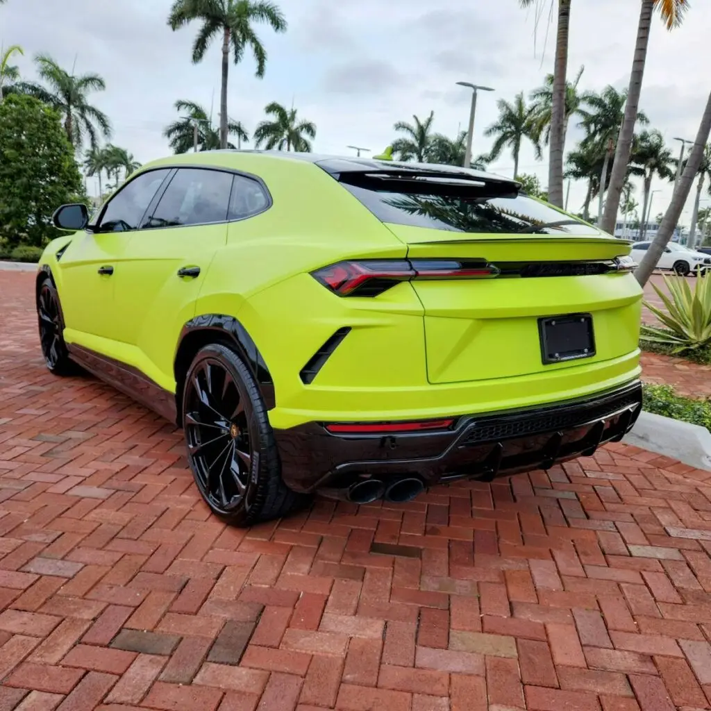 Rear-profile evaluation of a matte-green 2024 Lamborghini Urus S for a certified diminished value appraisal in Miami Gardens.