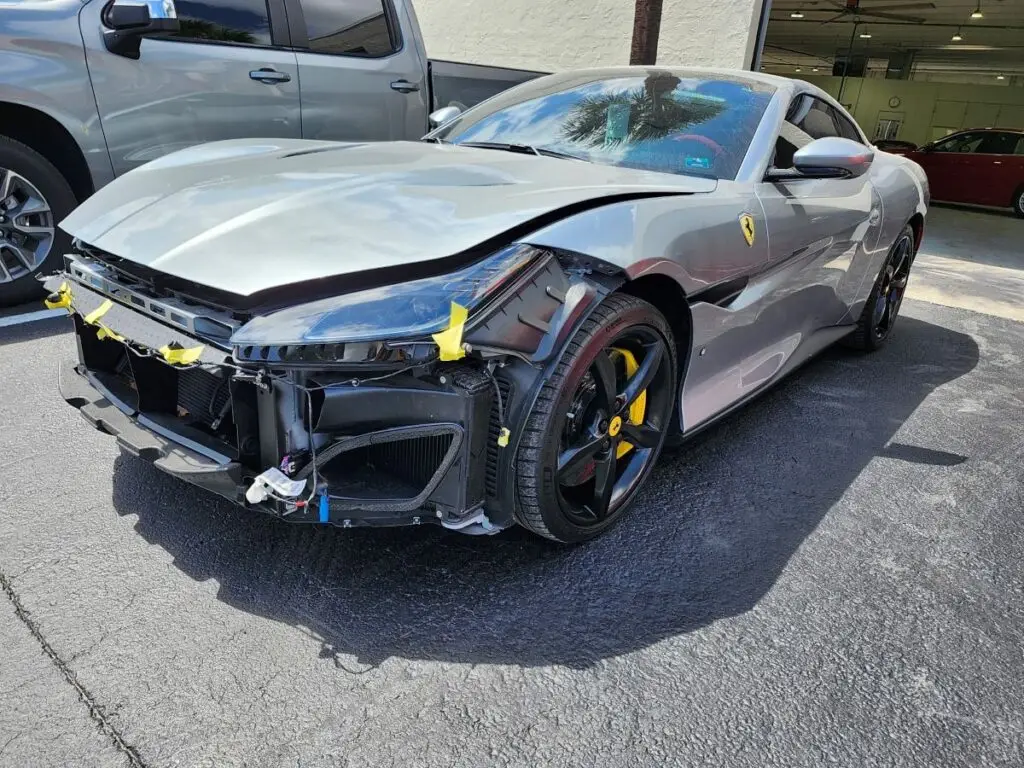 Professional audit of front-end structural and cosmetic repairs on a silver 2020 Ferrari Portofino for a diminished value appraisal in Naples Florida.
