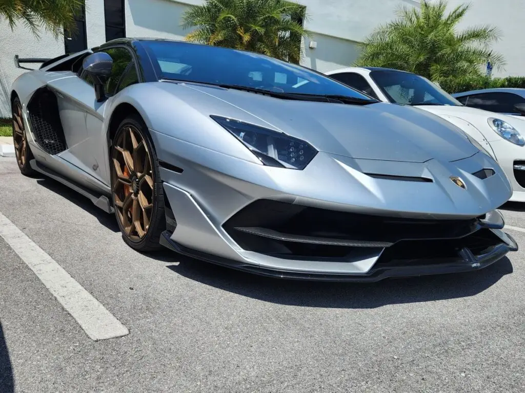 Front-profile evaluation of a silver 2022 Lamborghini Aventador Ultimae to support a certified diminished value appraisal Naples.