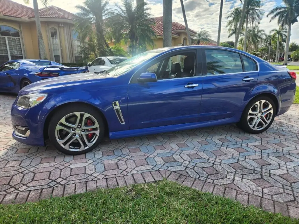 Side-profile valuation of a blue 2016 Chevrolet SS sedan to support a certified diminished value appraisal Orlando.