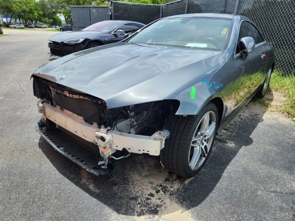 Documenting significant front-end collision damage on a grey 2018 Mercedes-Benz E400 for a diminished value appraisal Orlando.