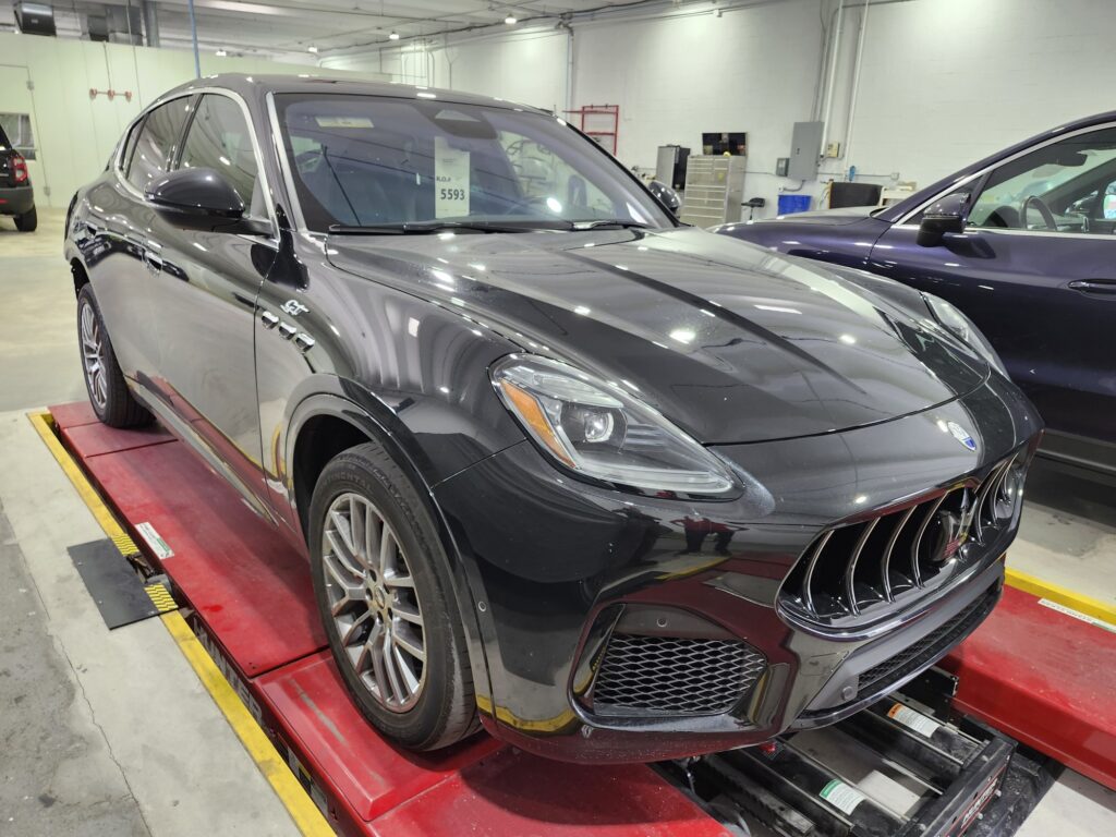 Documenting the market impact of front-end collision repairs on a black 2023 Maserati Grecale for a diminished value appraisal in Palm Beach Gardens.