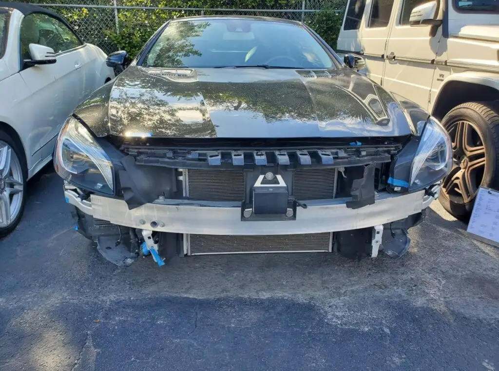 Documenting a front-end structural audit on a black Mercedes-Benz SL for a professional diminished value appraisal in Plantation Florida.