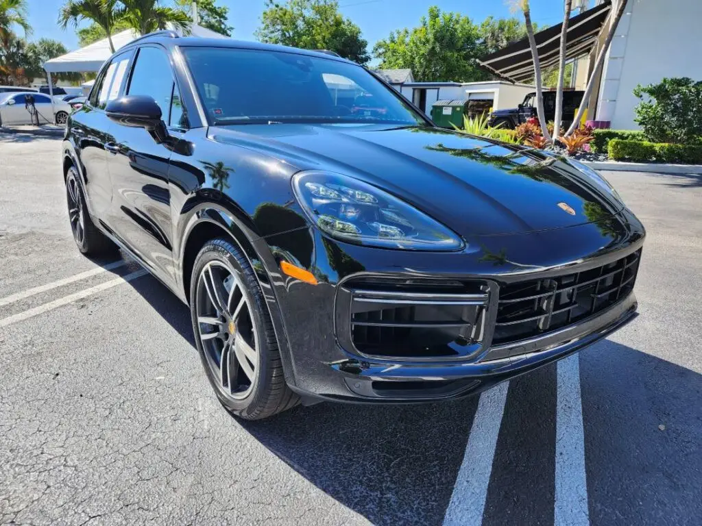 Professional market loss evaluation of a black Porsche Cayenne following collision repairs for a diminished value appraisal in Plantation Florida.