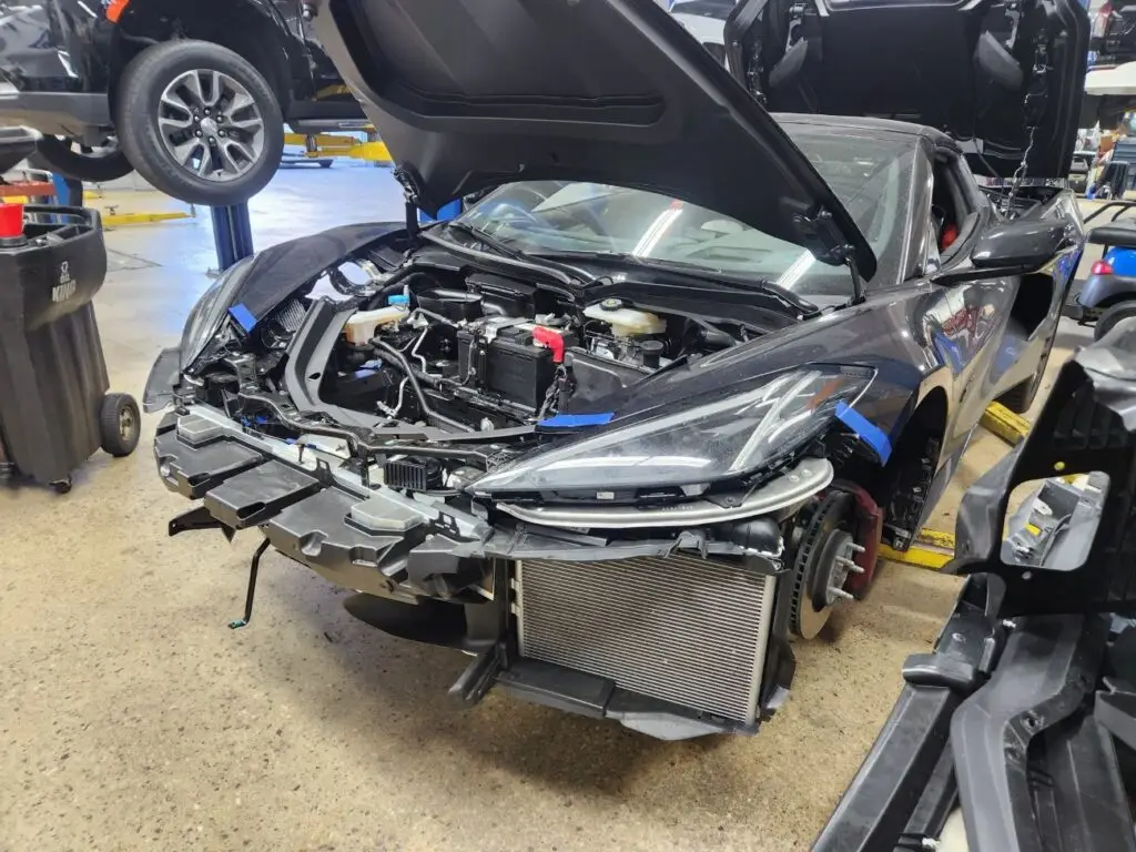 Documenting the market impact of front-end collision repairs on a black 2023 Chevrolet Corvette C8 for a diminished value appraisal in Pompano Beach.