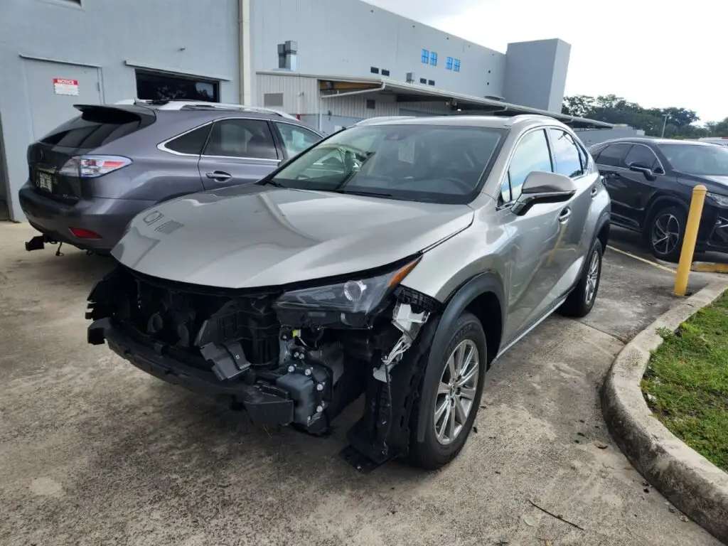 Professional audit of front-end structural and cosmetic repairs on a grey Lexus NX 300 for a diminished value appraisal in Pompano Beach Florida.