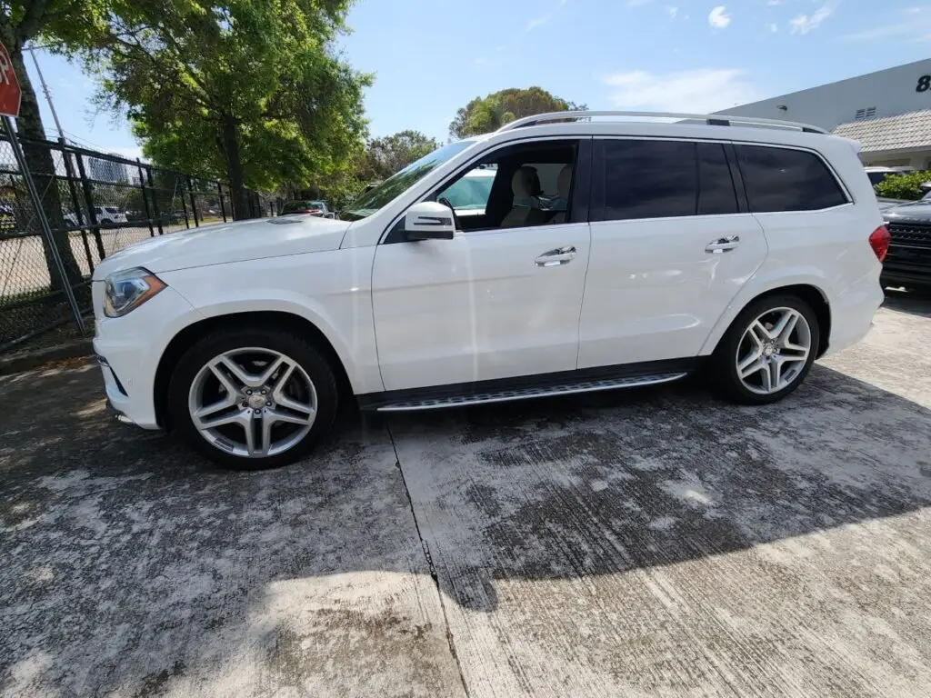 Side-profile market valuation of a white Mercedes-Benz GL550 to support a certified diminished value appraisal in Pompano Beach.