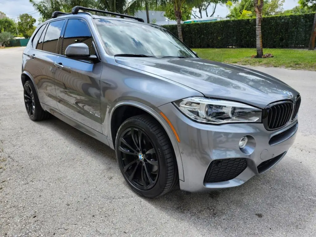 Side-view market assessment of a grey 2018 BMW X5 to support a certified diminished value appraisal Tallahassee Florida.