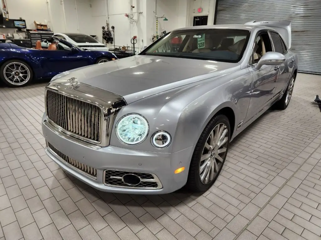Front-view market assessment of a silver 2017 Bentley Mulsanne in a professional service facility for a diminished value appraisal Tampa Florida.