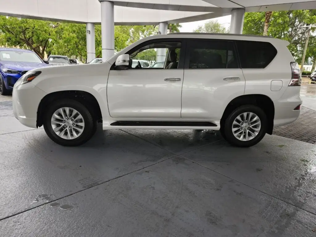 Side-profile valuation of a white Lexus GX during a diminished value appraisal Weston Florida to assess resale value after repair completion.