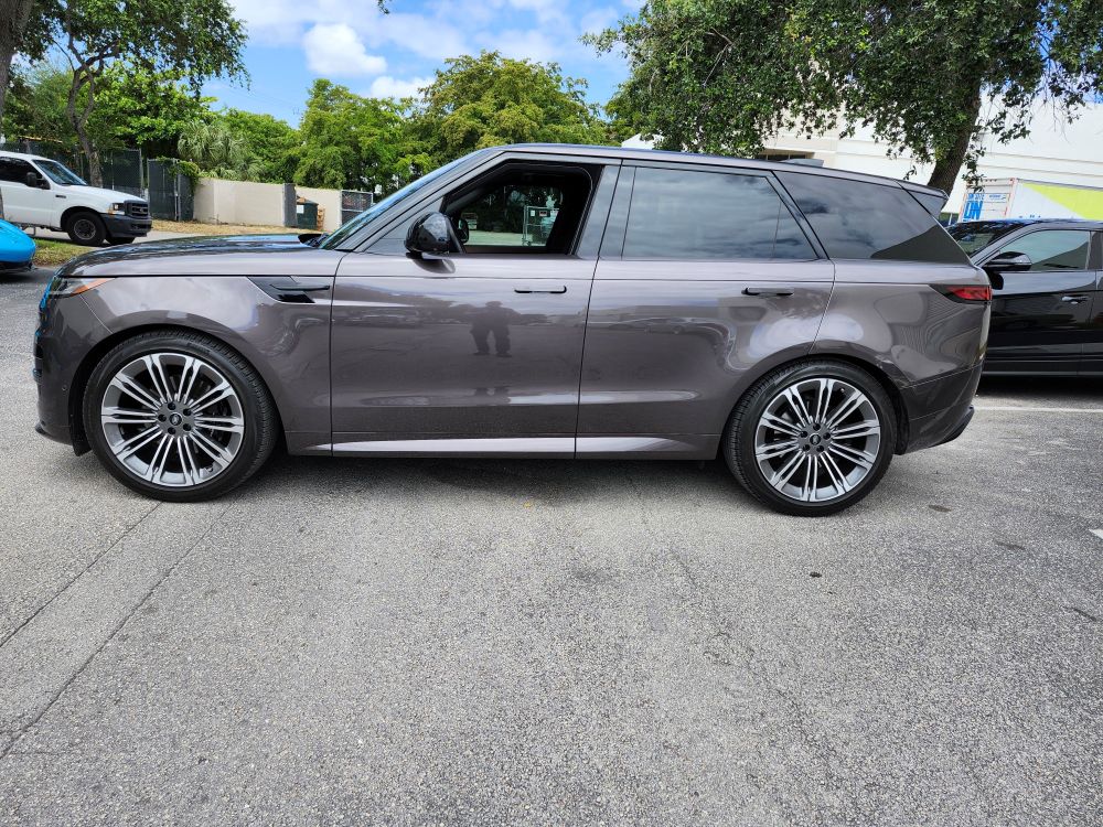Side-view market loss evaluation of a grey Land Rover Range Rover Sport for a certified diminished value appraisal Lake Worth Florida.