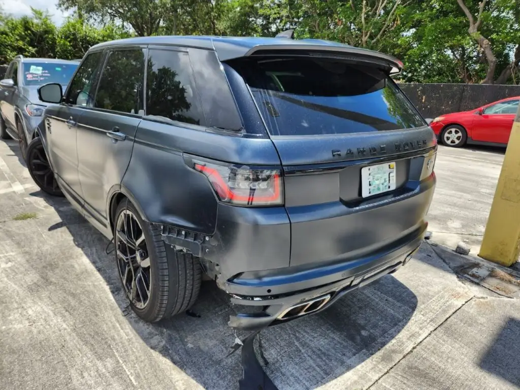 Assessing rear-end structural and bumper damage on a matte-finish Land Rover Range Rover Sport for a diminished value appraisal Weston.