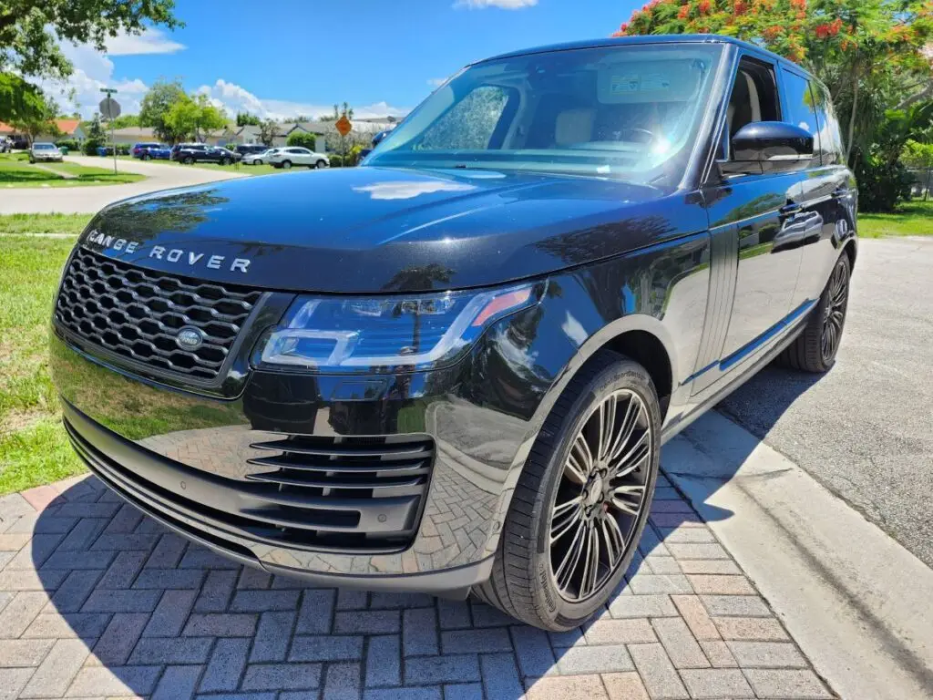 Structural and cosmetic impact evaluation on a black Land Rover Range Rover for a diminished value appraisal West Palm Beach Florida.