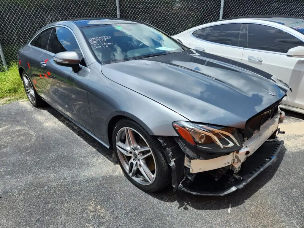 Evaluating inherent loss in value on a grey Mercedes-Benz E-Class Coupe during a diminished value appraisal in Parkland Florida.