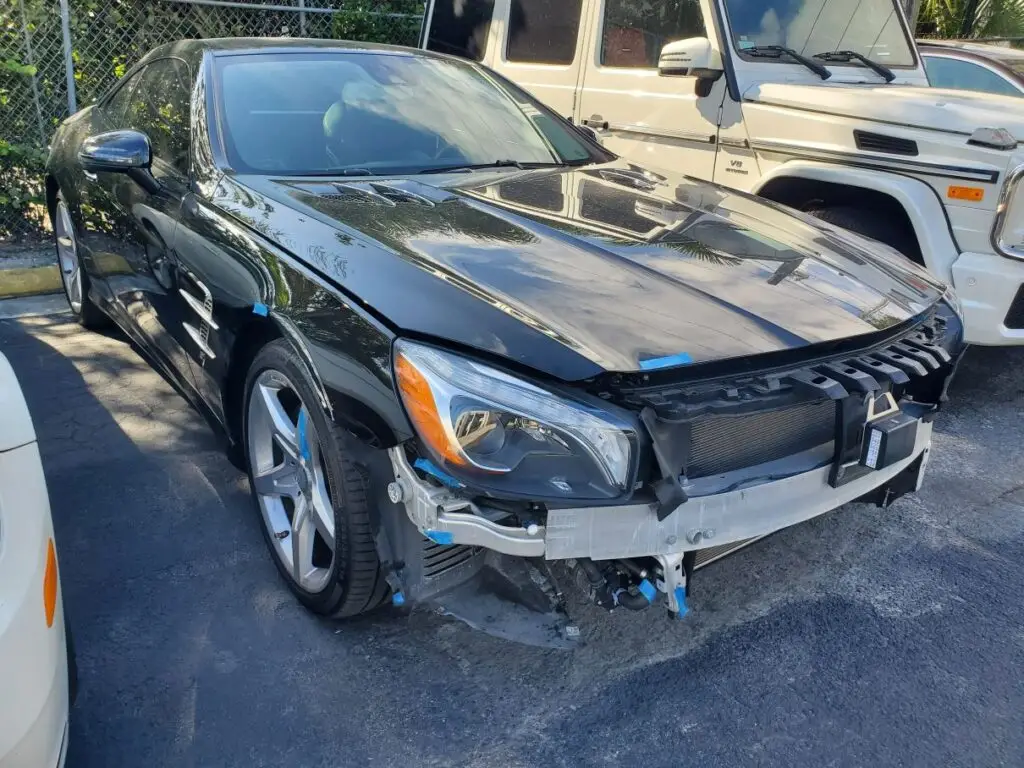 Documenting significant front-end collision repairs on a black Mercedes-Benz SL for a professional diminished value appraisal in Wellington.