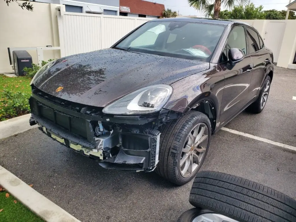 Comprehensive analysis of market value loss through a detailed diminished value appraisal Fort Lauderdale for high-performance German SUVs like this Porsche Macan recovering from frontal impact damage.