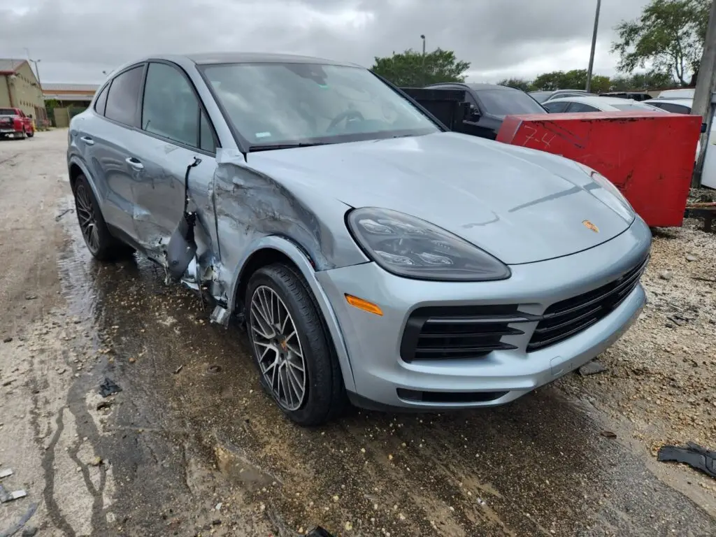 Porsche Cayenne with severe passenger-side impact damage requiring a detailed diminished value appraisal to recover lost resale value in Palm Beach.