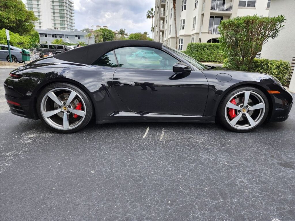 Auto Praise conduction an in depth market analysis of a black 2022 Porsche 911 Carrera Cabriolet for a diminished value appraisal in Hollywood Florida.
