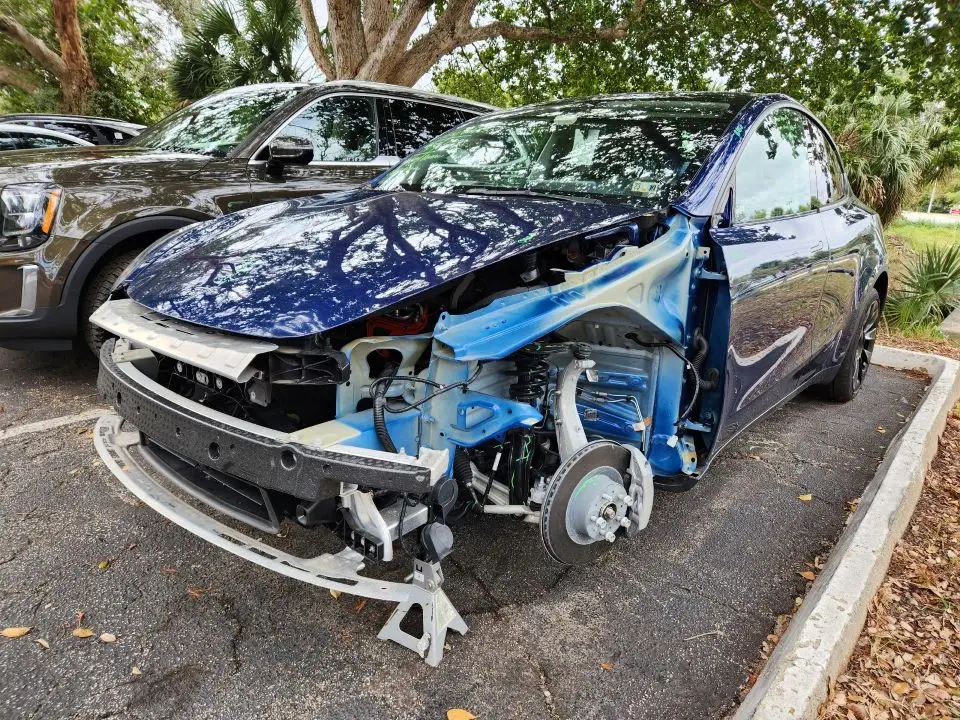 Damaged Tesla Model 3 total loss appraisal and insurance settlement dispute in Coconut Creek Florida.