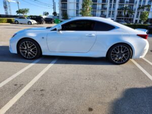 A professional independent car appraisal being performed on a Lexus in Boca Raton to document diminished value.