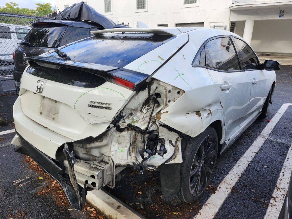 Severe structural rear body damage on a Honda Civic inspected for a total loss appraisal in Coral Springs FL