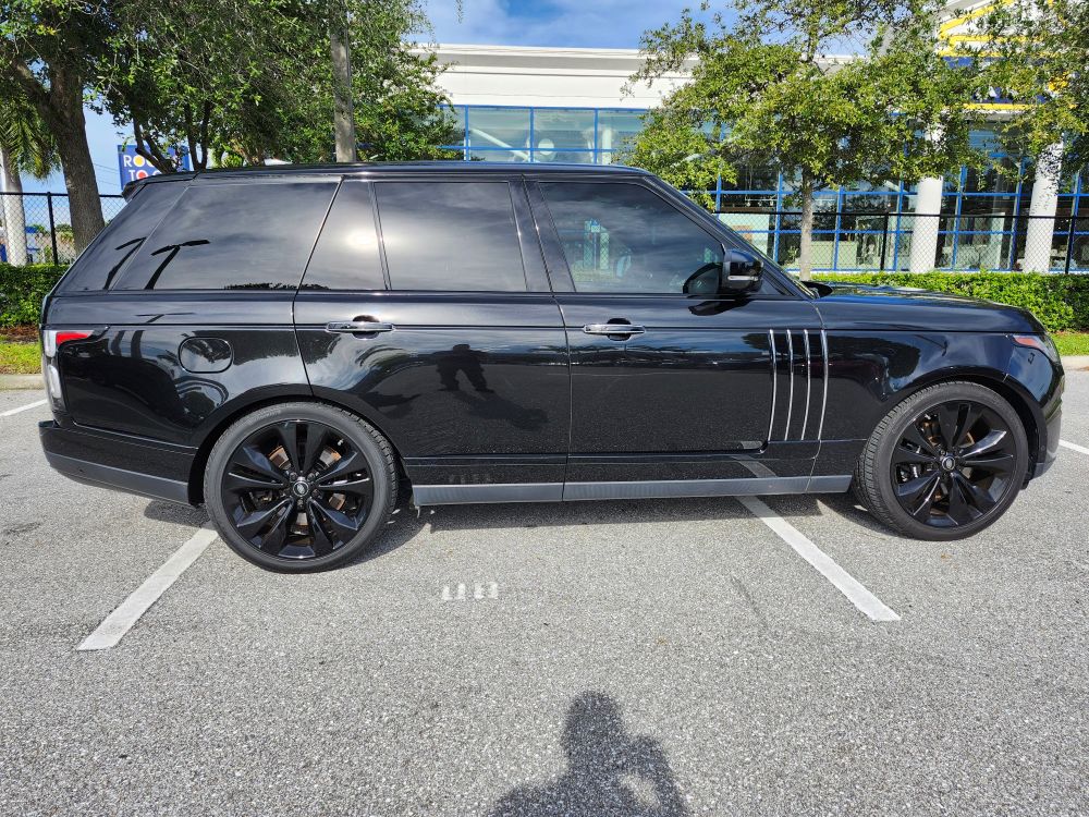 2021 Black Range Rover luxury SUV side profile parked in Florida lot during pre-purchase inspection
