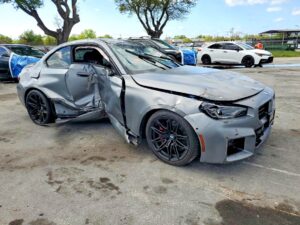 BMW M2 coupe with severe driver side and front-end collision damage at Jacksonville assessed for total loss appraisal