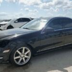 Mercedes-Benz C250 sedan with front-end collision damage at Orlando being evaluated for total loss appraisal