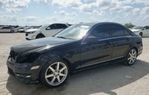 Mercedes-Benz C250 sedan with front-end collision damage at Orlando being evaluated for total loss appraisal