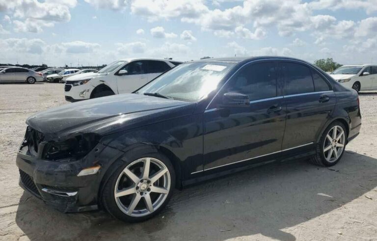 Mercedes-Benz C250 sedan with front-end collision damage at Orlando being evaluated for total loss appraisal