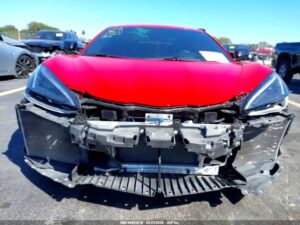 2023 Chevrolet C8 Corvette with catastrophic front-end collision damage exposing full chassis in Sarasota assessed for total loss appraisal.