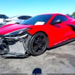 Chevrolet Corvette with front-end collision damage exposing radiator in Sarasota assessed for total loss appraisal
