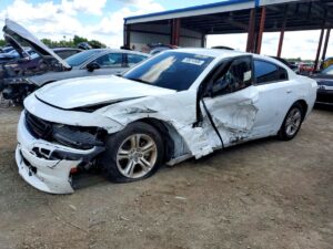 Dodge Charger sedan with severe front and side collision damage at Sarasota assessed for total loss appraisal