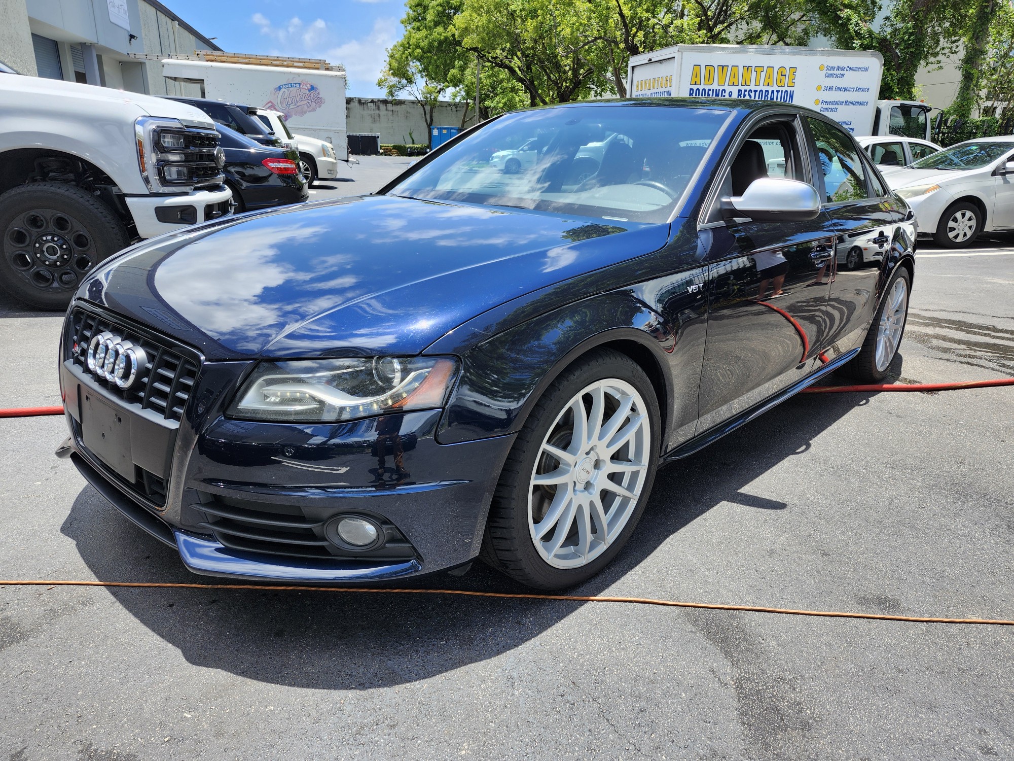 Audi S4 sedan with white wheels photographed in Tallahassee for total loss appraisal

