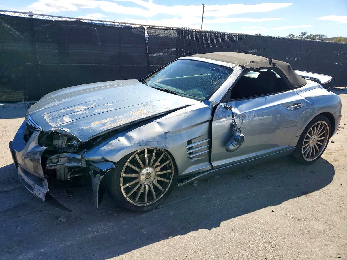 Silver Chrysler Crossfire convertible with severe front-end and driver side collision damage in Tallahassee assessed for total loss appraisal